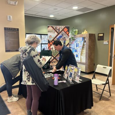 People at a table talking about their ideas.